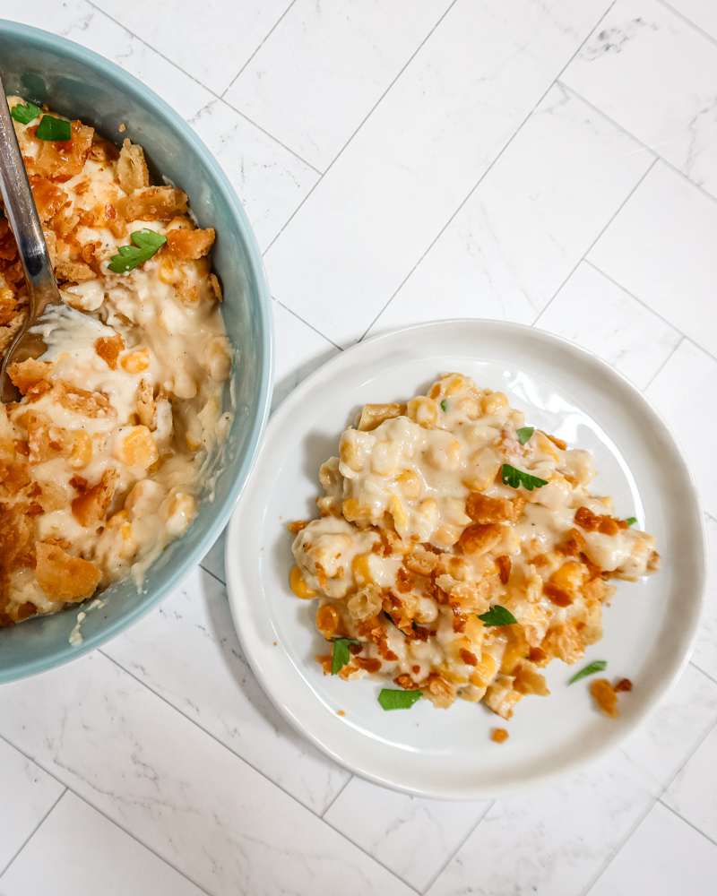 A bowl of scalloped corn with crumb topping.