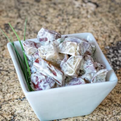 A small dish of roasted potato salad.