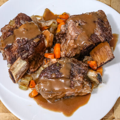 Slow cooker short ribs and gravy. on a plate