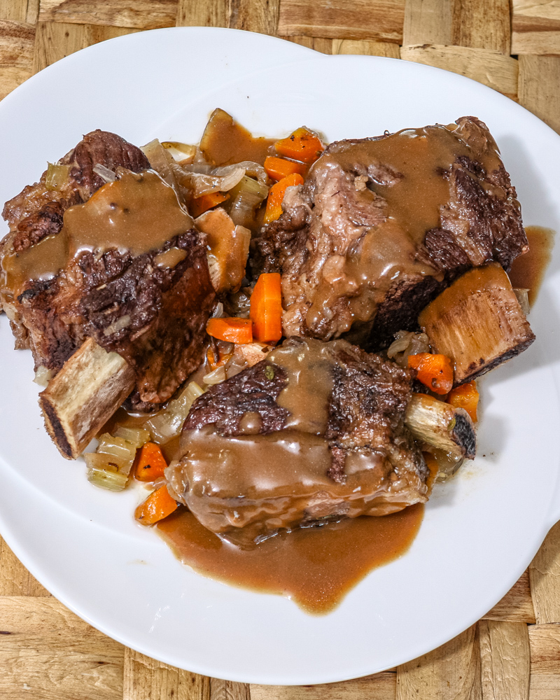 Slow cooker short ribs and gravy. on a plate