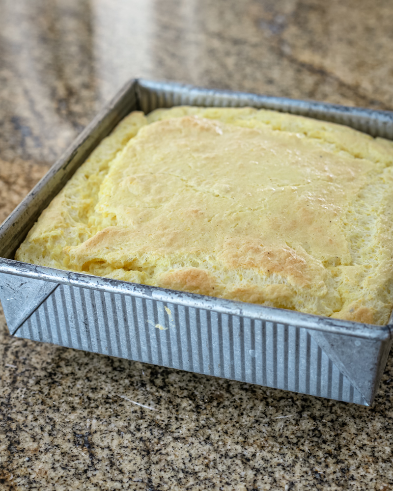 A pan of freshly baked southern spoonbread.