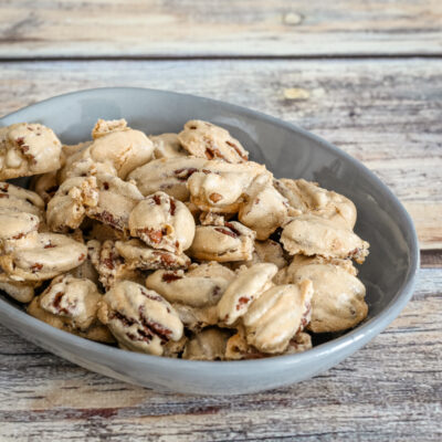 Sugared pecans snack in a small decorative dish