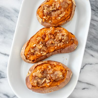 Twice baked sweet potatoes on a serving tray.