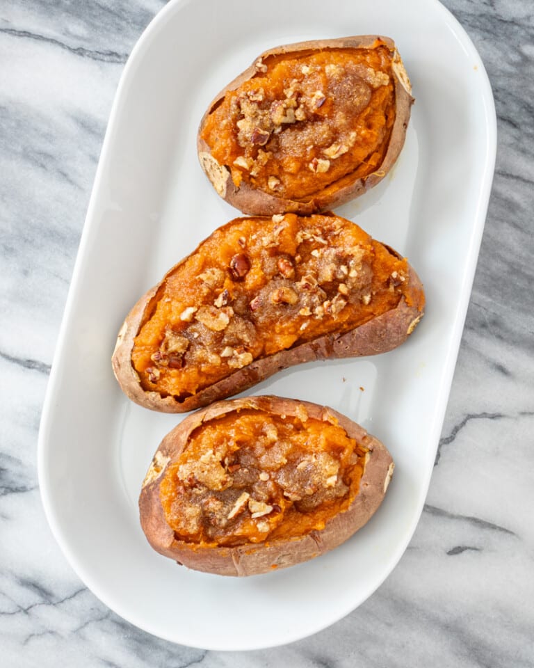 Twice baked sweet potatoes on a serving tray.