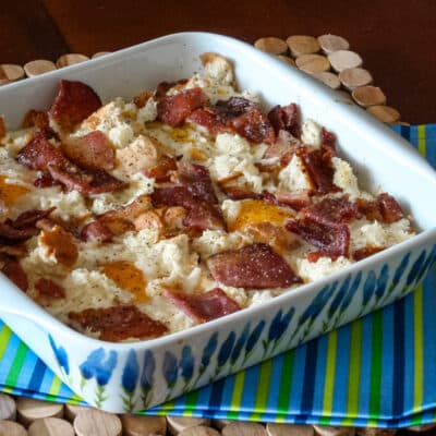 A baking dish with a bacon and egg casserole.