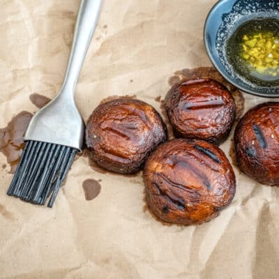 Grilled mushrooms with melted butter and brush.