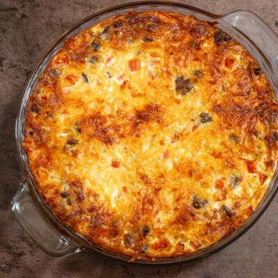 A cheeseburger pie with cheese topping.