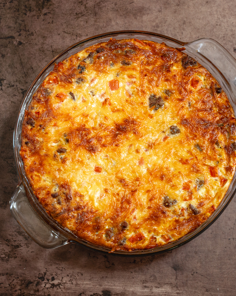A cheeseburger pie with cheese topping.