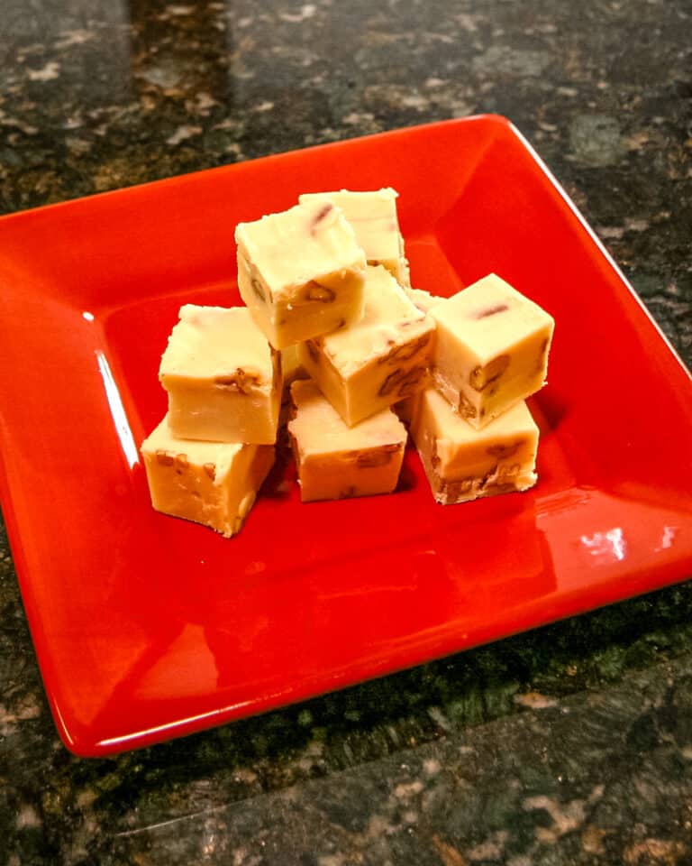 A red plate with sour cream fudge.