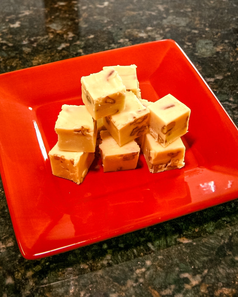 A red plate with sour cream fudge.