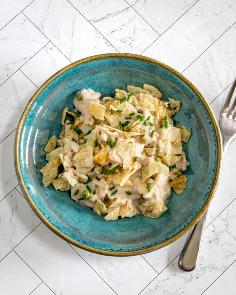 Tuna casserole with potato chip topping and some chives for garnish.
