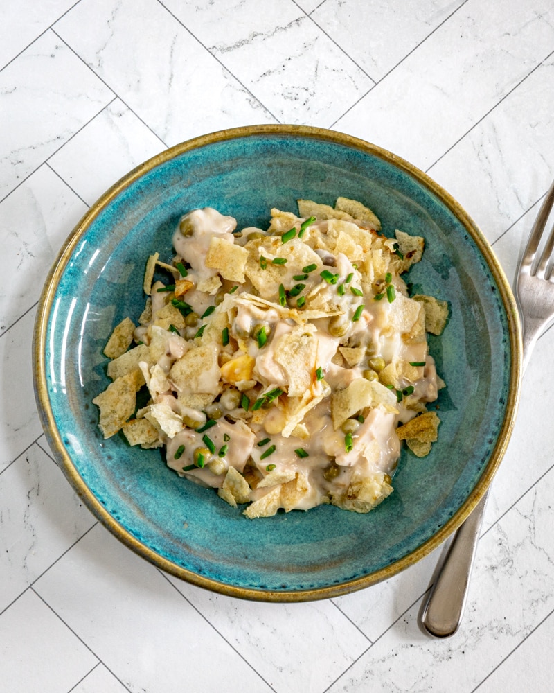 Tuna casserole with potato chip topping and some chives for garnish.