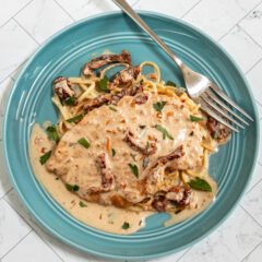 Marry me chicken served on cooked spaghetti with creamy sundried tomato sauce.