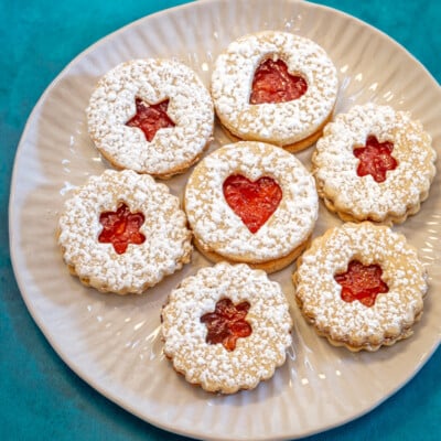 Linzer cookies on a plate.