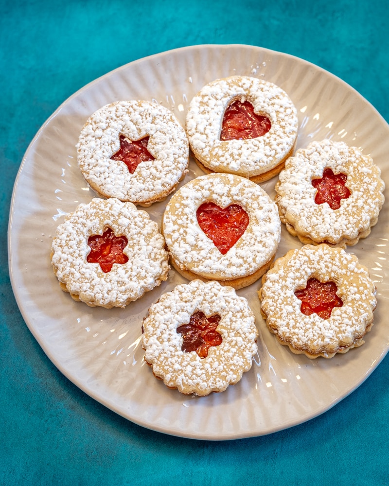 Linzer cookies on a plate.