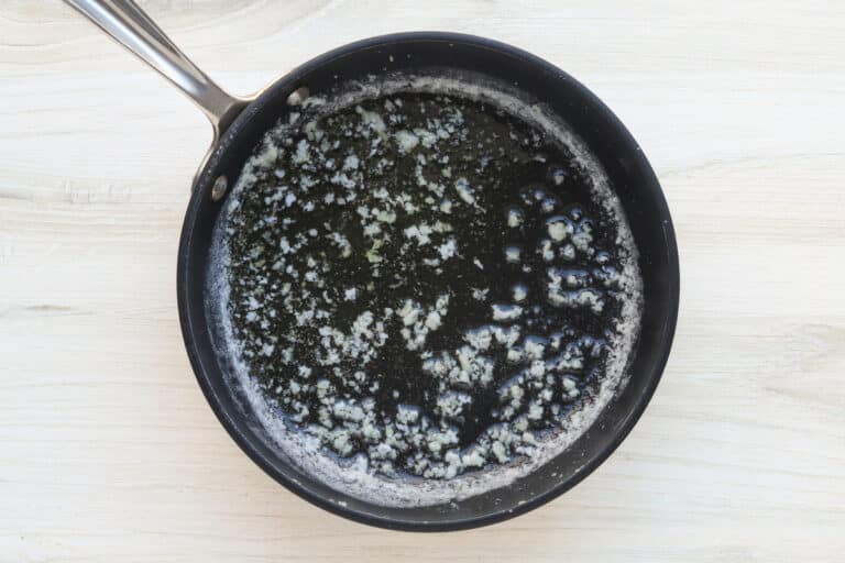 Garlic bread prep: melting the butter with garlic.
