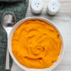 A serving bowl with mashed butternut squash.