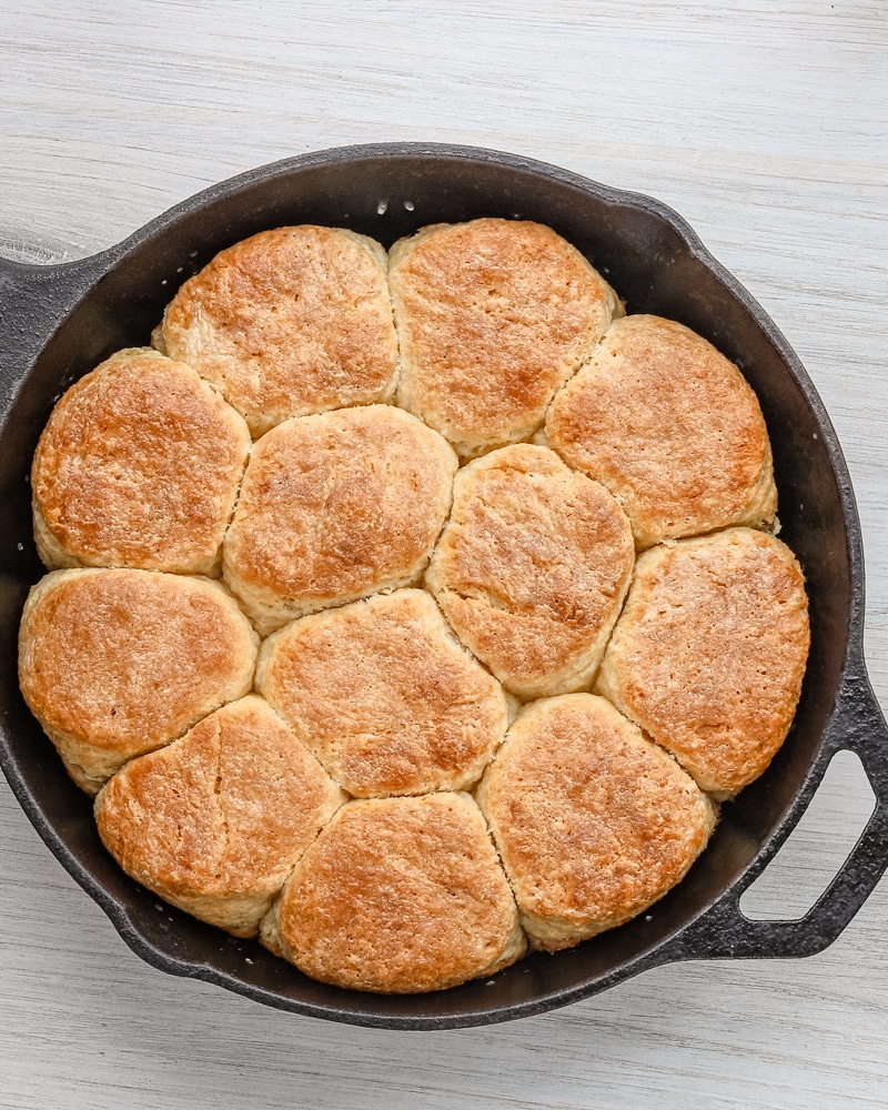 A skillet with fluffy baked angel biscuits.