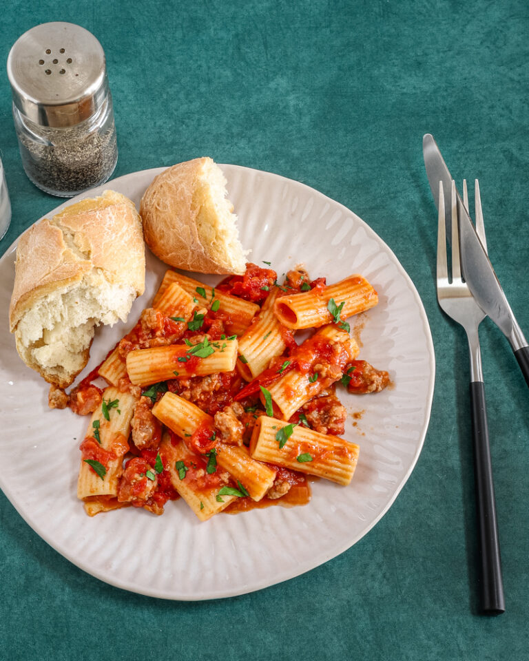 Overhead shot with a bright and flavorful sausage ragu made with Italian sausage, hand-crushed tomatoes, garlic, and onions.
