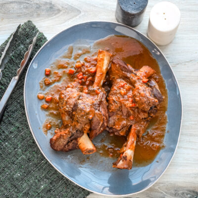 Braised Lamb Shanks and Sauce on a Platter