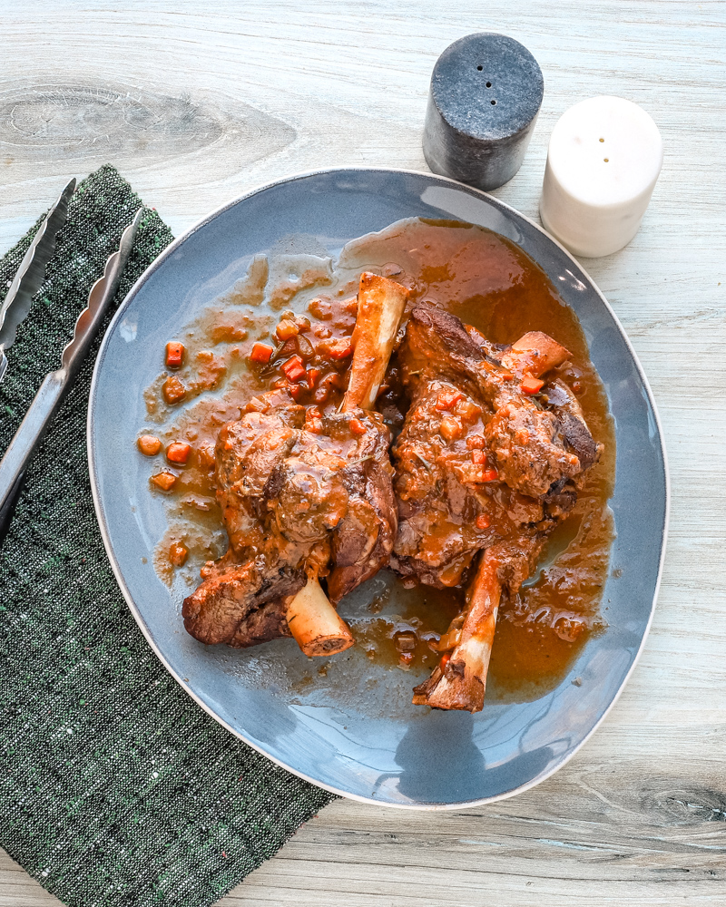 Braised Lamb Shanks and Sauce on a Platter