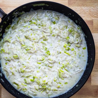 creamed leeks in a skillet.