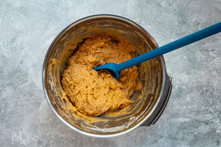 Stirring pumpkin fritter batter.