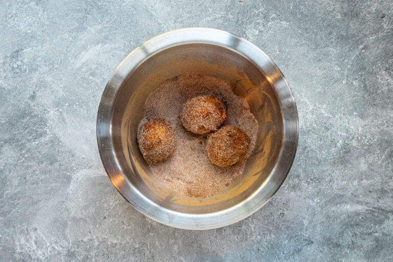 Pumpkin fritters rolled in cinnamon sugar.
