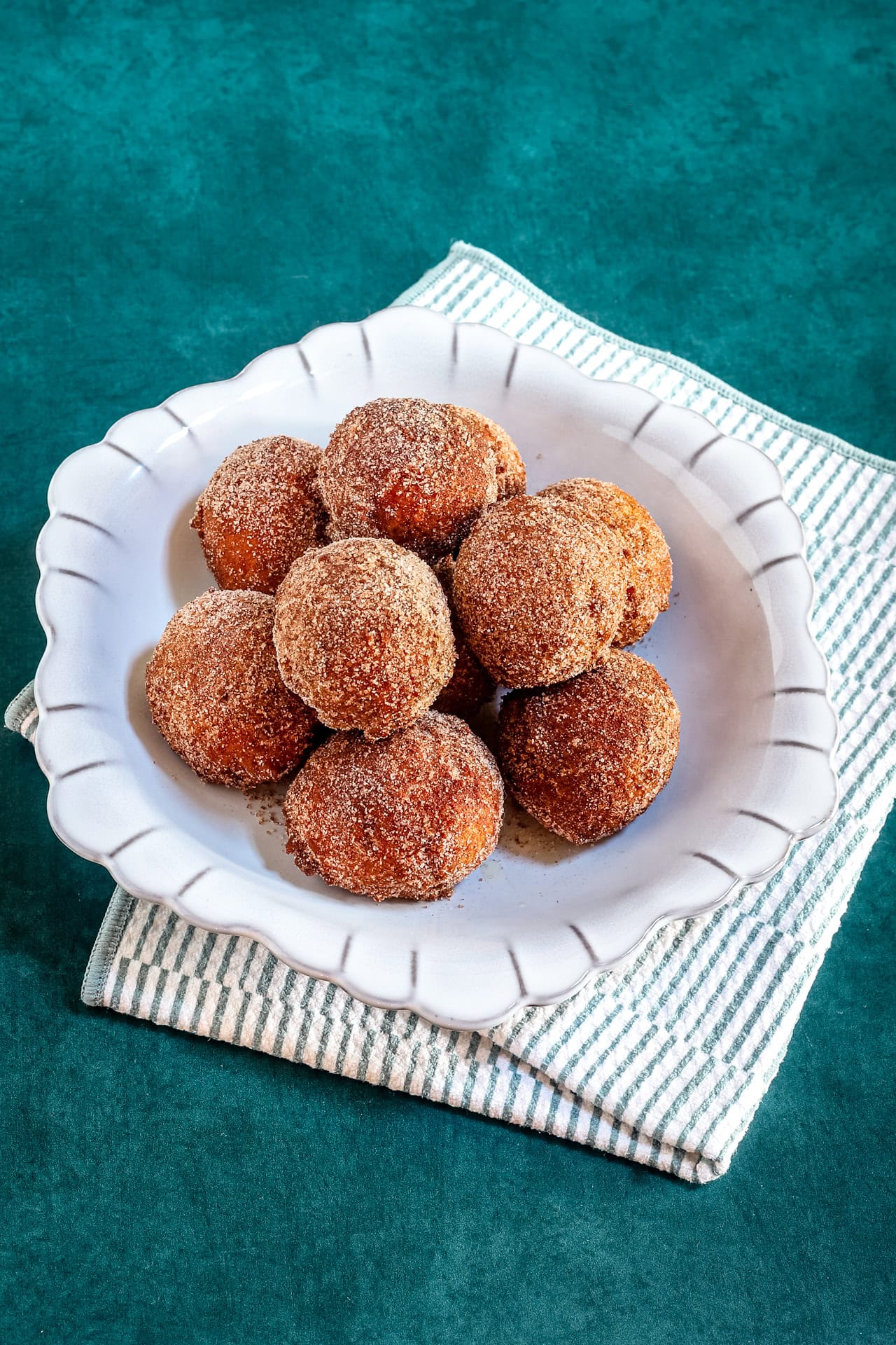 A dish of cinnamon sugar-coated pumpkin fritters.
