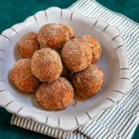 A dish of cinnamon sugar-coated pumpkin fritters.
