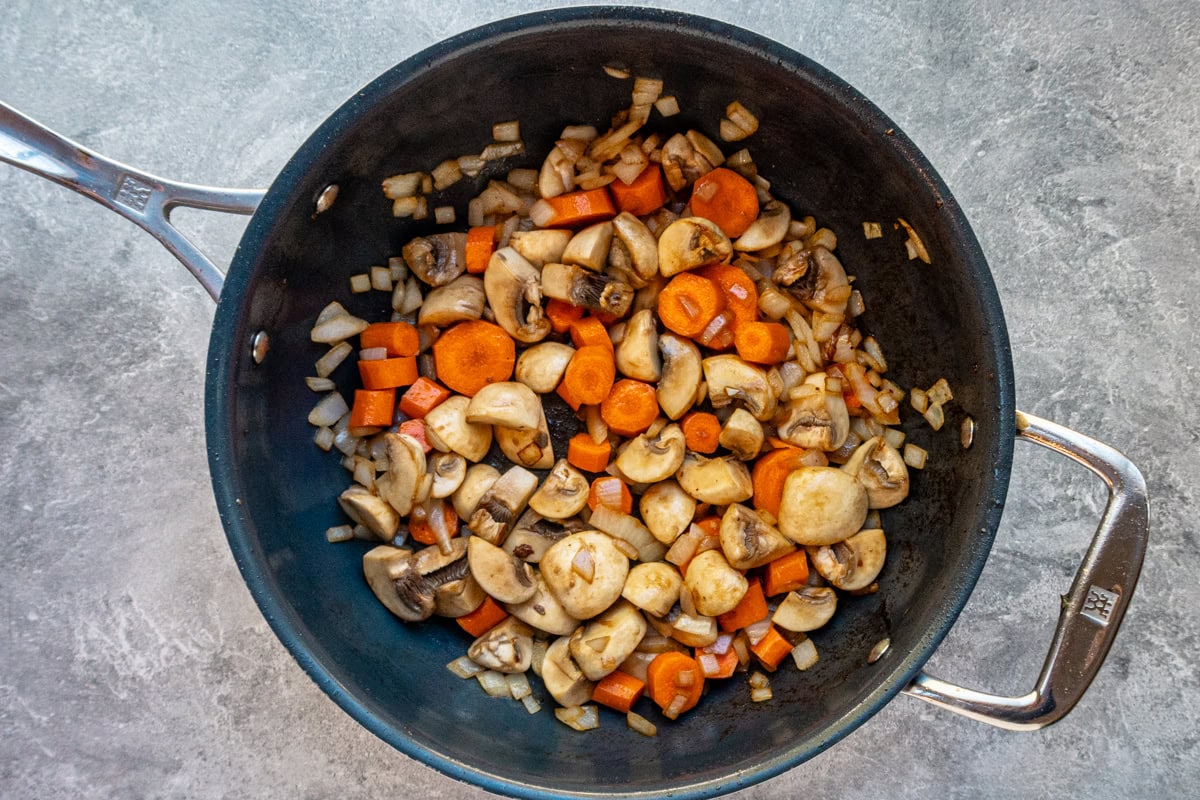 Cooking the vegetables for beef Burgundy stew.