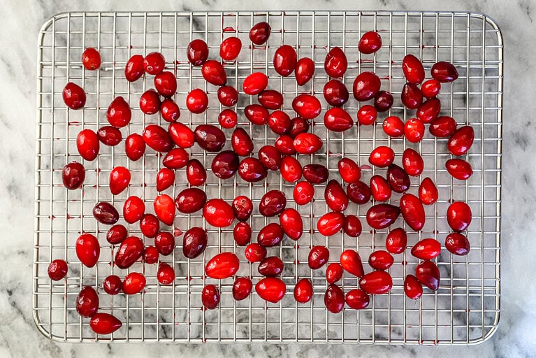 Drying the cranberries on a rack.