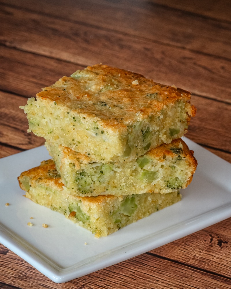 Broccoli Cornbread in a stack on a small plate.