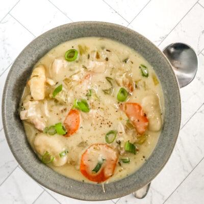 Chicken and dumpling soup with gnocchi dumplings, vegetables, and a creamy chicken broth.