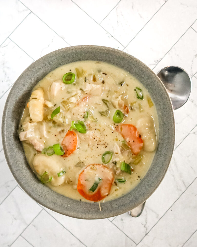Chicken and dumpling soup with gnocchi dumplings, vegetables, and a creamy chicken broth.
