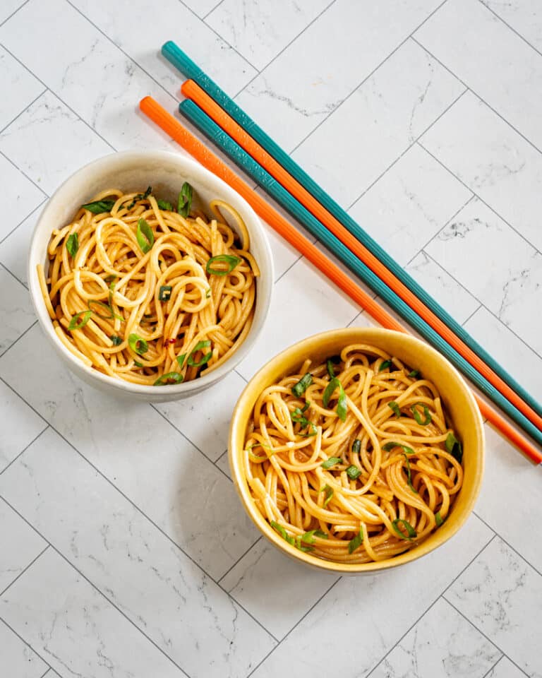 Two small bowls of chili garlic noodles.