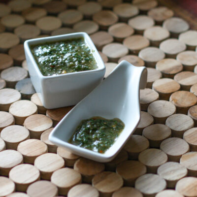 Chimichurri sauce in small containers for serving.