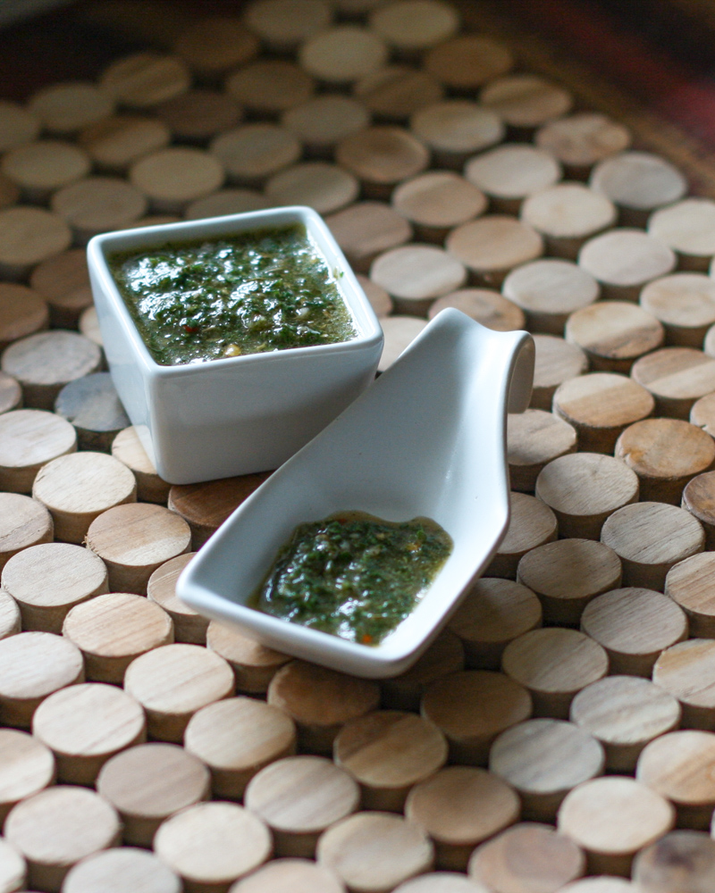Chimichurri sauce in small containers for serving.