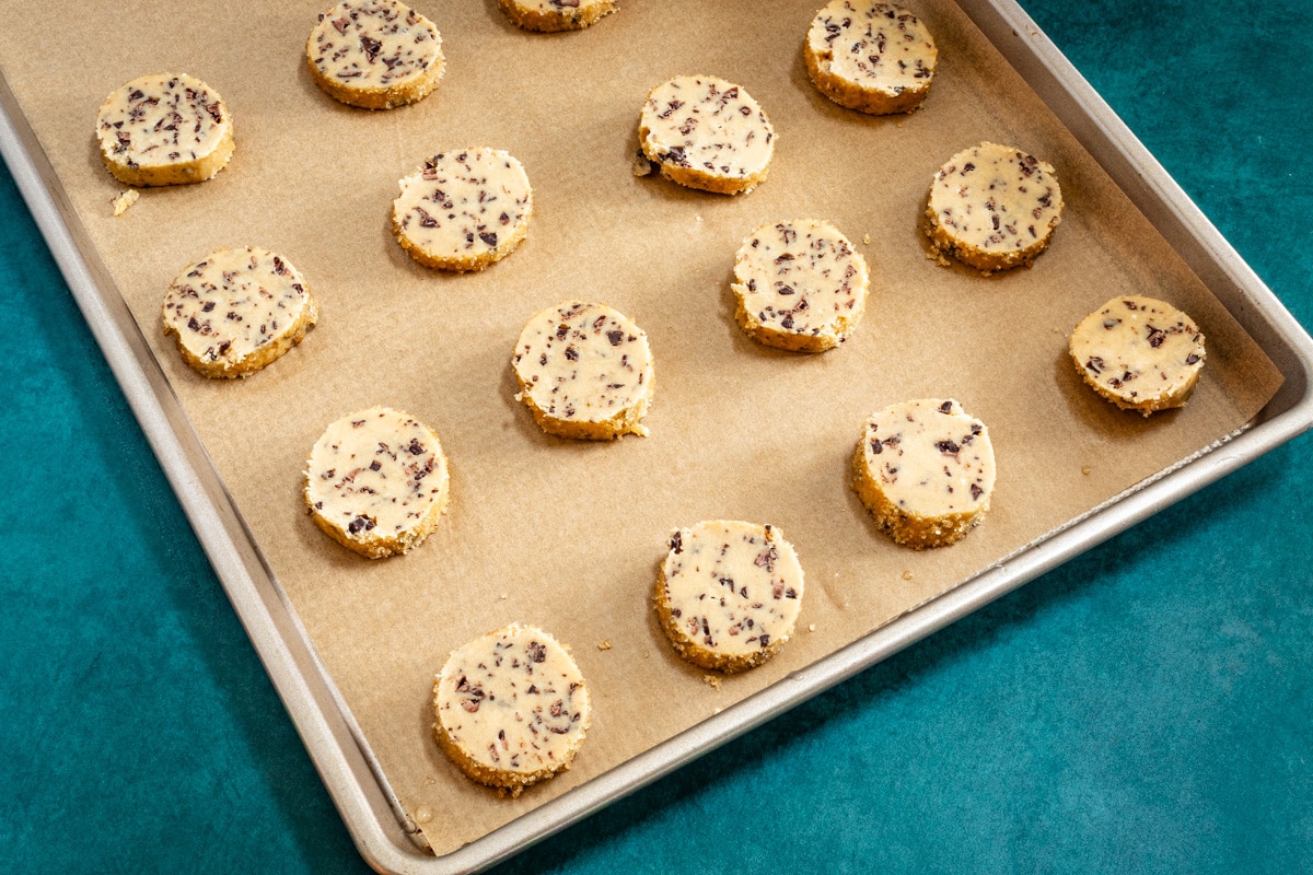 Baking sheet with chocolate chip sable cookies.