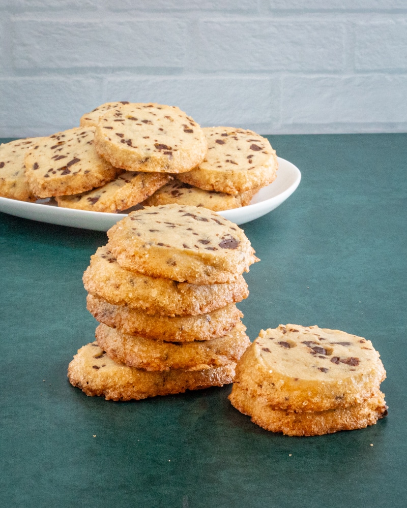 A stack of chocolate chip sablé cookies.