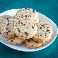 A stack of chocolate chip sablé cookies.