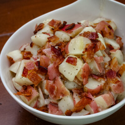 A serving bowl of German potato salad.