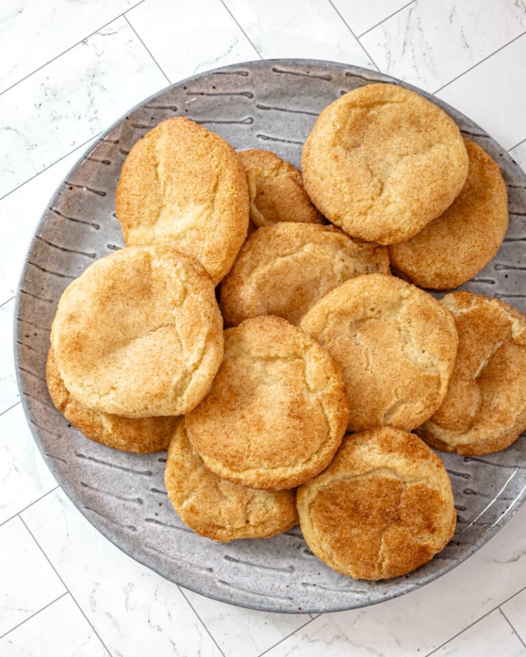Gluten-free snickerdoodles on a gray plate.