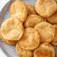 Gluten-free snickerdoodles on a gray plate.