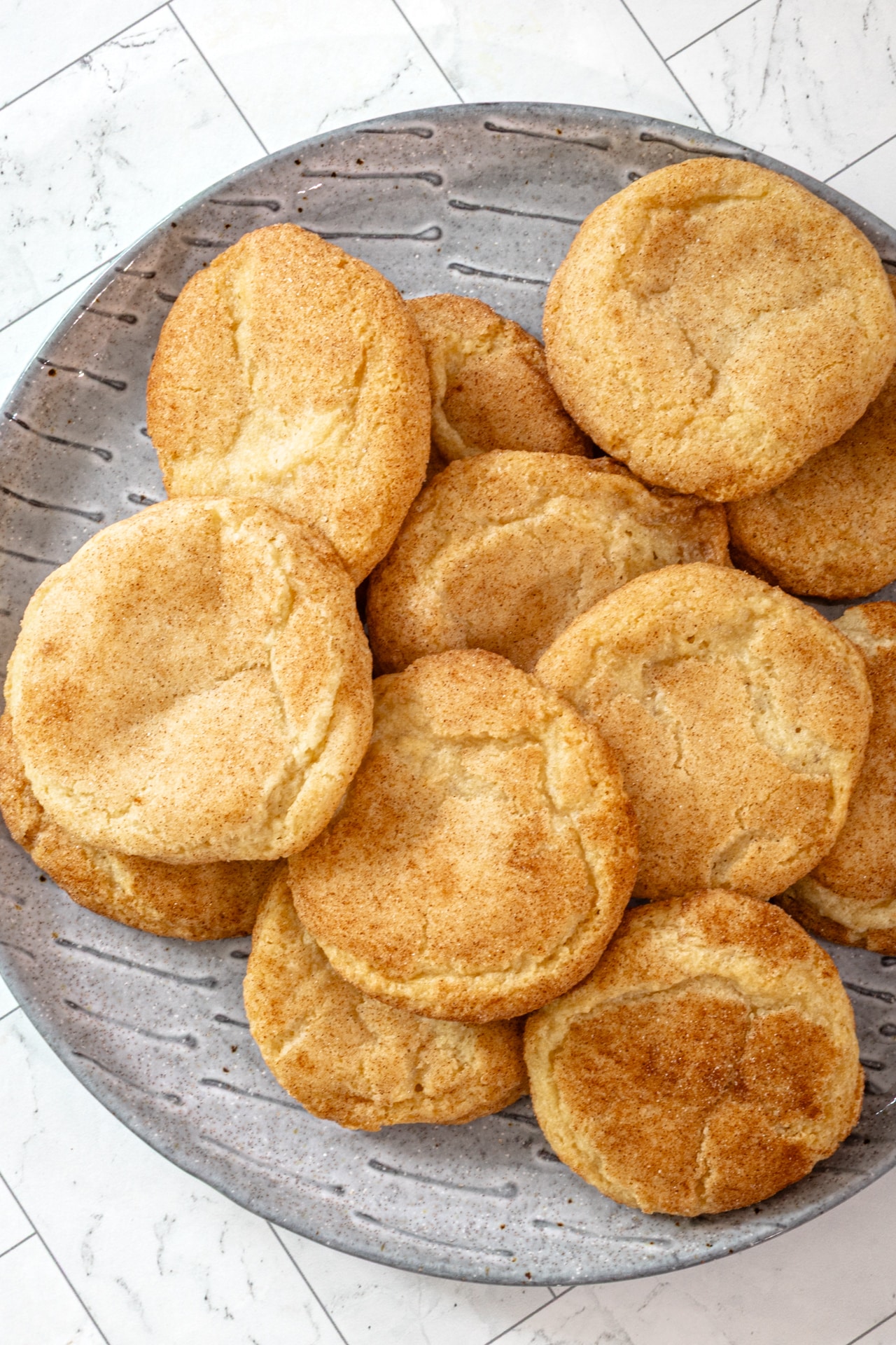 Gluten-free snickerdoodles on a gray plate.