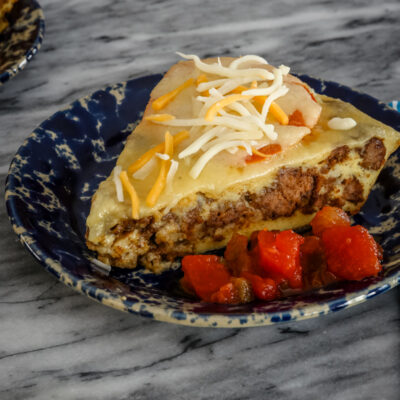 A slice of cheeseburger pie.