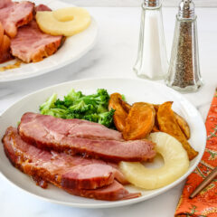 Glazing the Instant Pot ham for a quick finish in the oven.