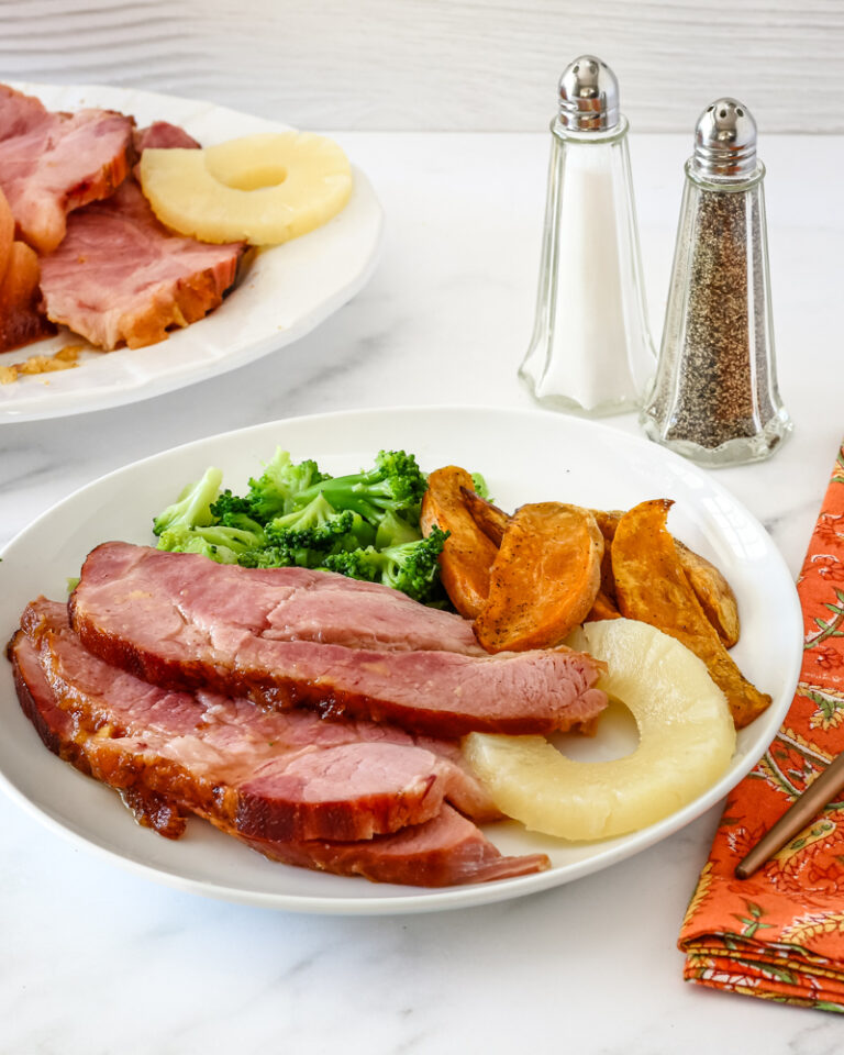 Glazing the Instant Pot ham for a quick finish in the oven.