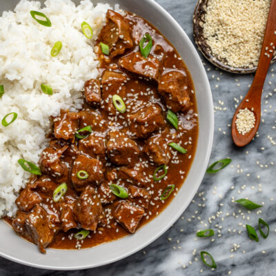 Korean inspired beef and rice in a large bowl.