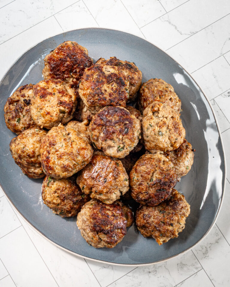 Meatballs on a blue serving tray.